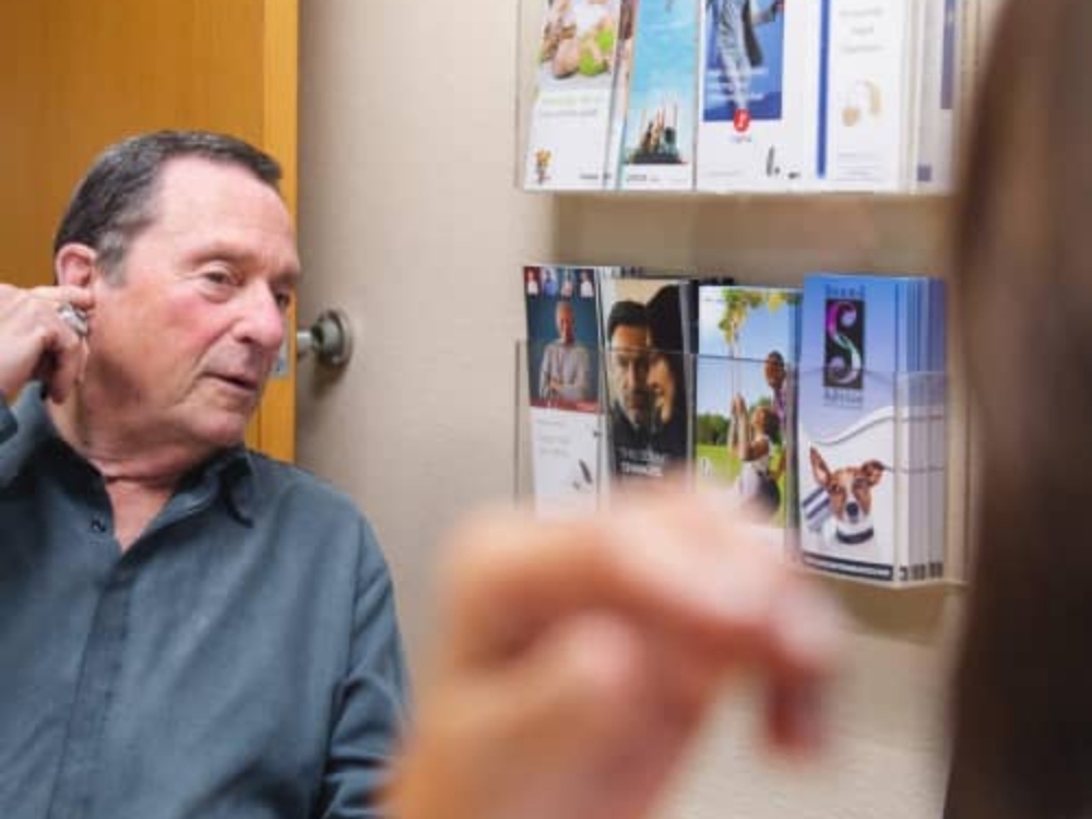 Patient learning about hearing loss types from Dr. Beverly Lew, Au.D. at Sound Advice in Burbank, CA